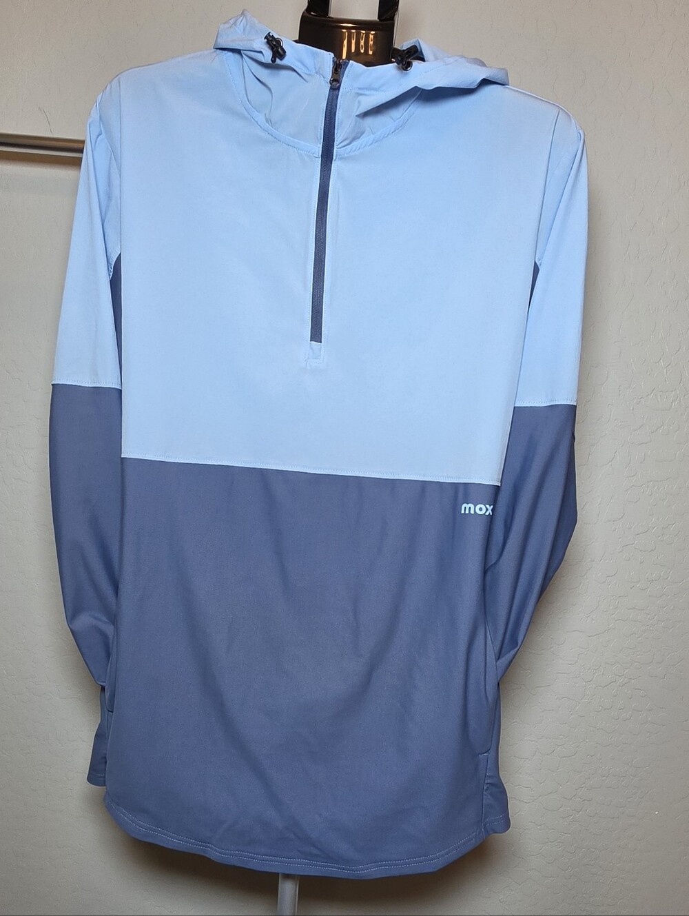 Moxie color-block half-zip hooded pullover windbreaker/performance jacket.